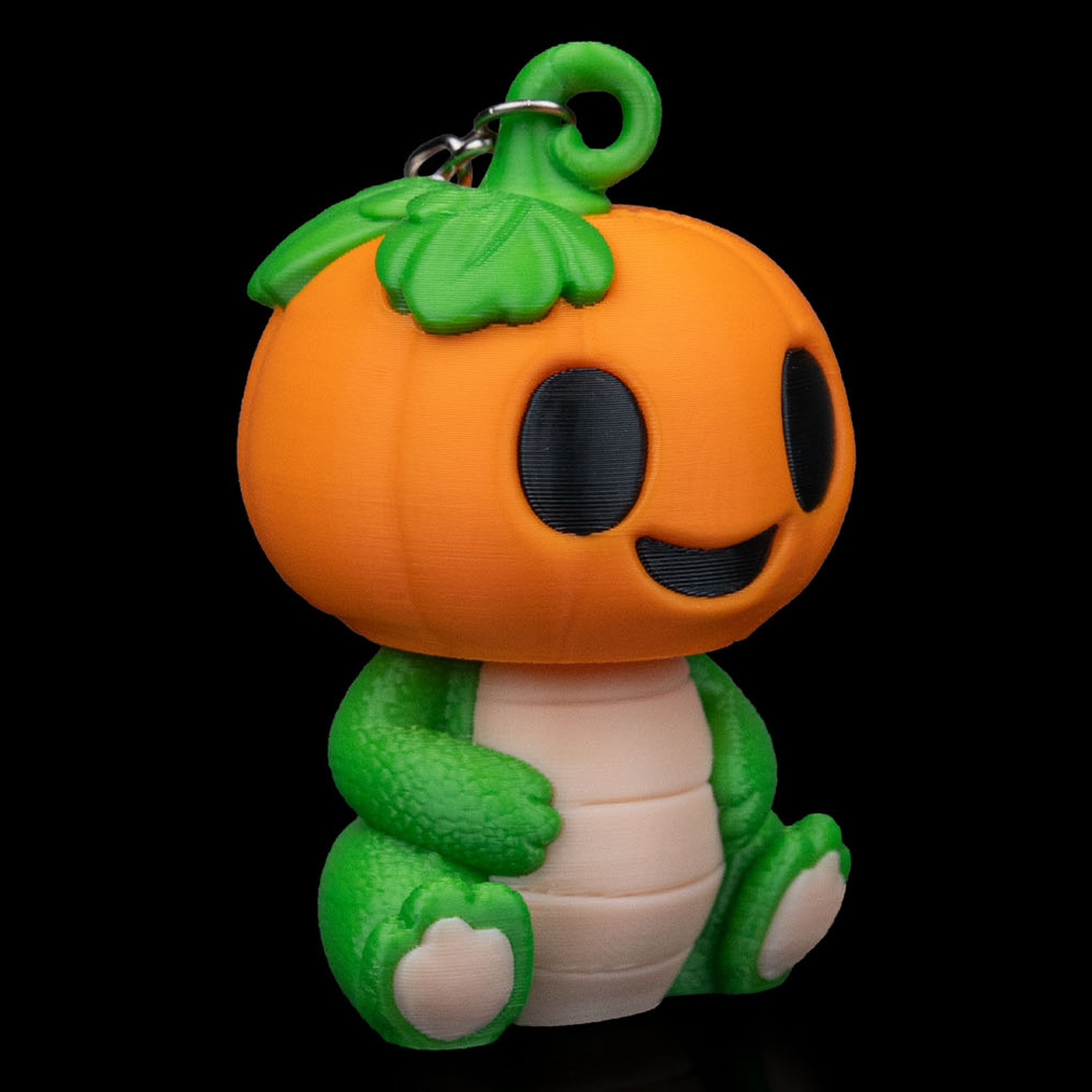 Llavero de dinosaurio calabaza Dino PumpKing