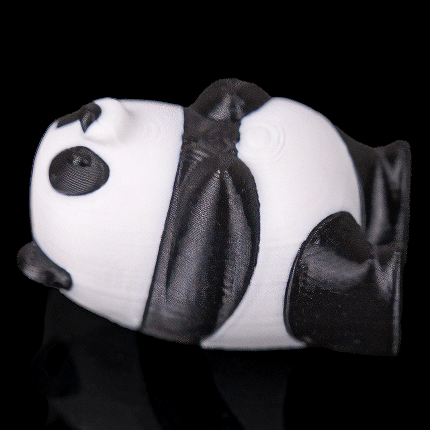 Panda tumbado para juego de equilibrio