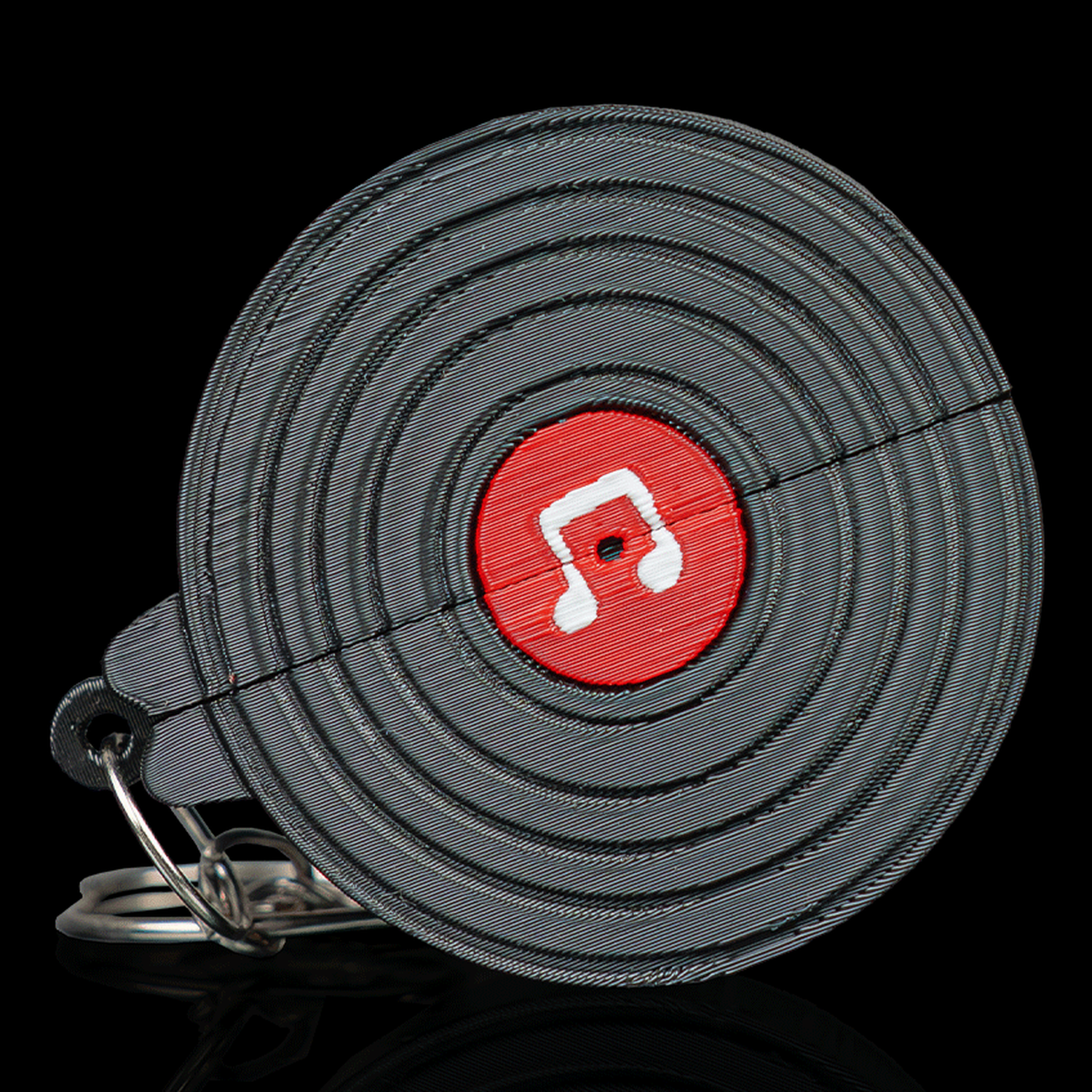 Llavero portapúas con forma de vinilo