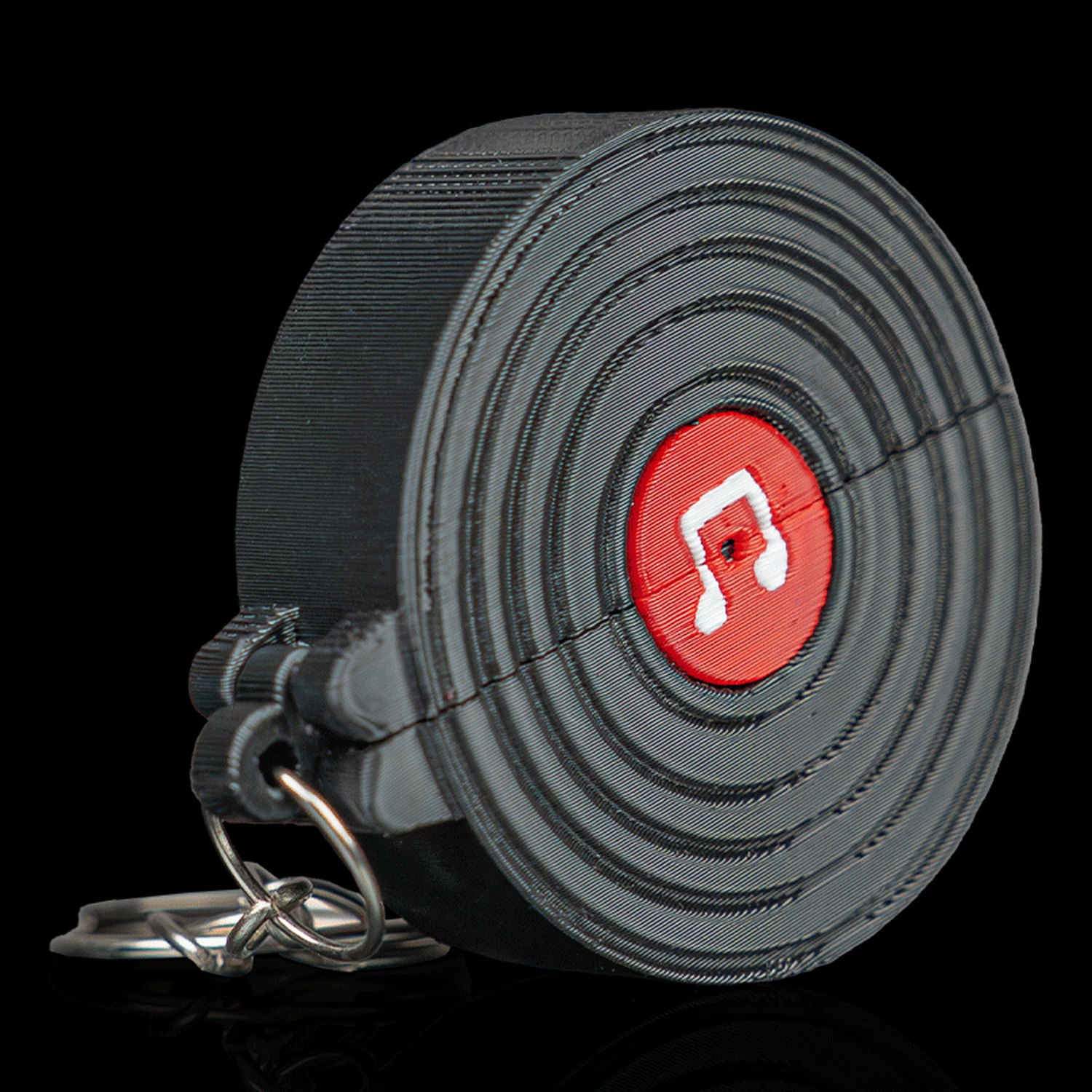 Llavero portapúas con forma de vinilo