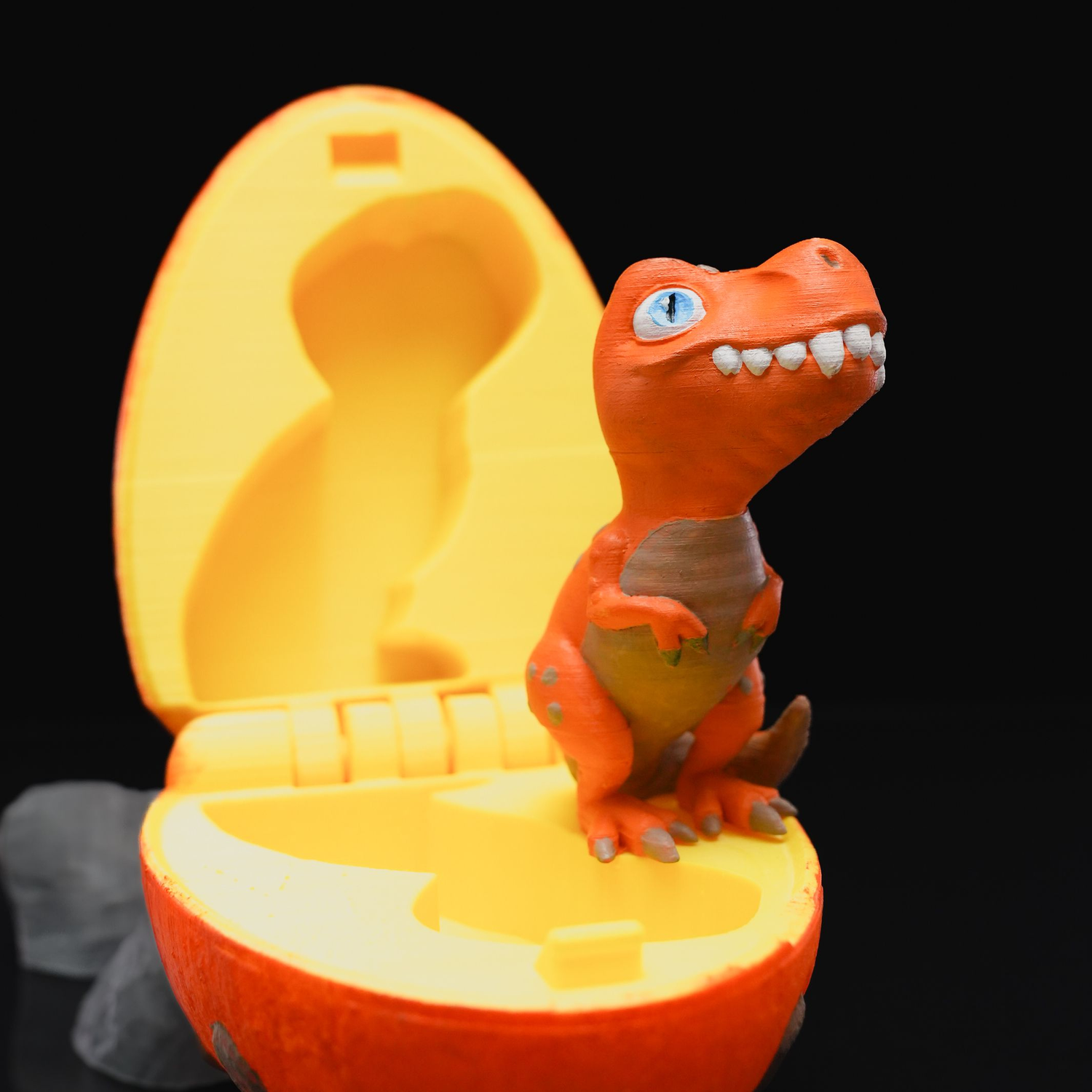 Figura decorativa con forma de huevo T-Rex